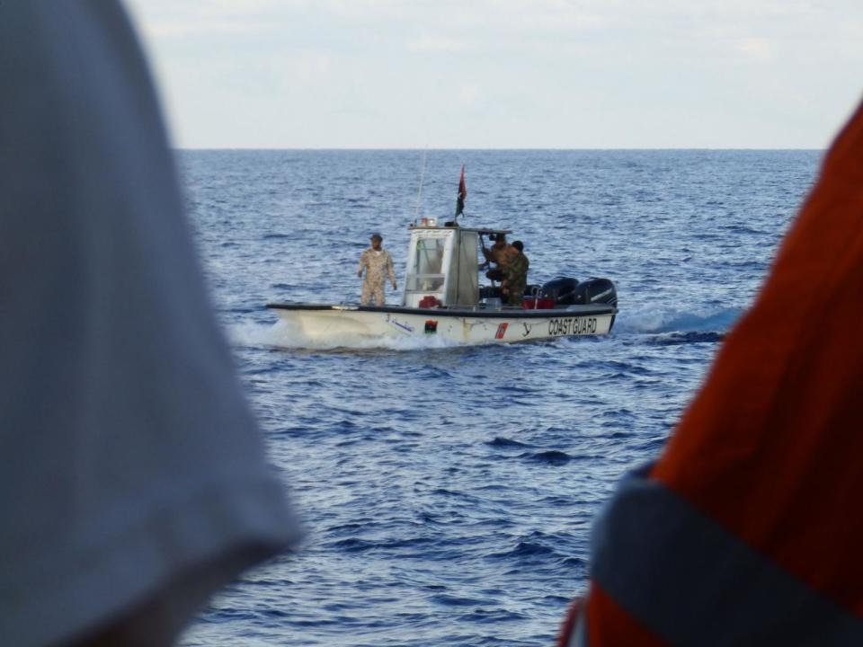 A Libyan coastguard boat observing a rescue by MSF's Bourbon Argos ship on 4 November 2016 (Lizzie Dearden)