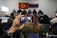 First Nations members of the Tyendinaga Mohawk Territory and Wet'suwet'en Nation speak at a news conference at the Mohawk Community Centre in Tyendinaga