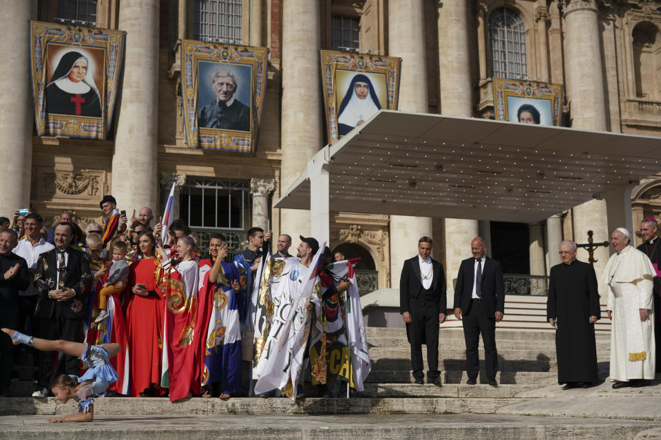 Participants at the Italian International Circus festival perform for Pope Francis during his weekly general audience, in St.Peter's Square, at the Vatican, Wednesday, Oct. 16, 2019. (AP Photo/Andrew Medichini)