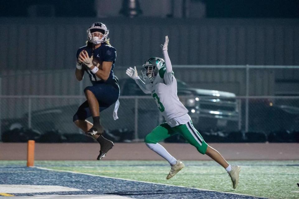Casa Roble Rams Cole Owens (11) catches a 21 yard pass for a touchdown past Dixon Rams Leo Iglesias (3) during the first quarter in the game Friday, Oct. 28, 2022, at Casa Roble High School in Orangevale.