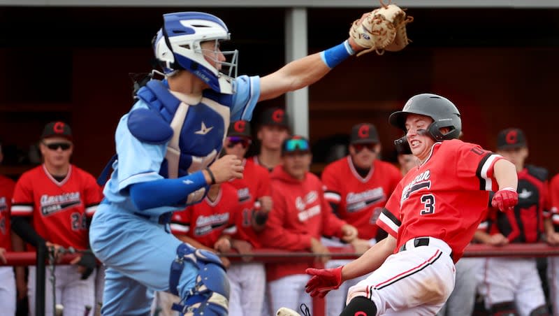 American Fork’s Dax Greening slides home before getting tagged by Pleasant Grove’s catcher Kale Dunn in American Fork on Friday, April 19, 2024.