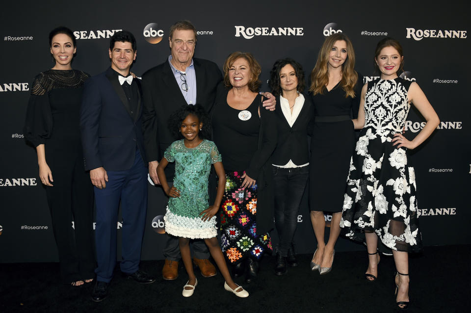 From left, <em>Roseanne</em> cast members Whitney Cummings, Michael Fishman, John Goodman, Jayden Rey, Roseanne Barr, Sara Gilbert, Sarah Chalke, and Emma Kenney arrive at the Los Angeles premiere of <em>Roseanne</em> in Burbank, Calif., March 23, 2018. (Photo: Jordan Strauss/Invision/AP, File)