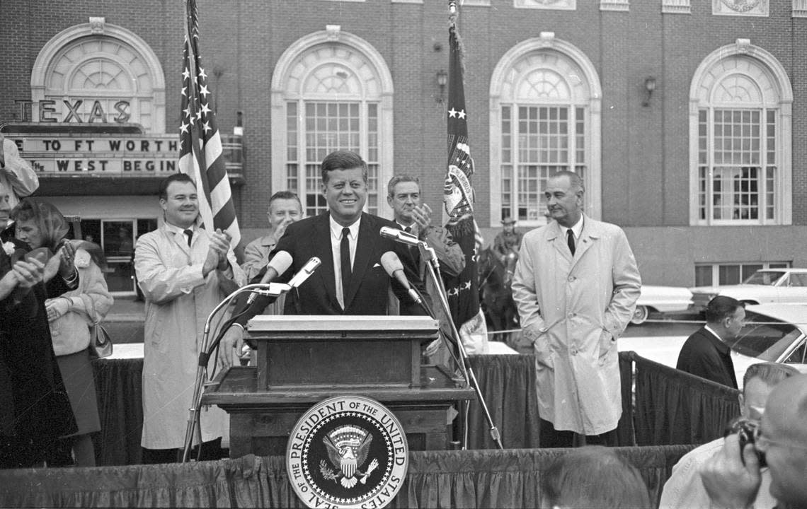 John F. Kennedy speaking to crowd in front of Hotel Texas, Fort Worth. V.P. Lyndon B. Johnson to JFK’s left and Texas Governor John Connally over JFK’s left shoulder, Sen. Ralph Yarborough over right shoulder, and State Sen. Don Kennard to JFK’s right, on morning of November 22, 1963.