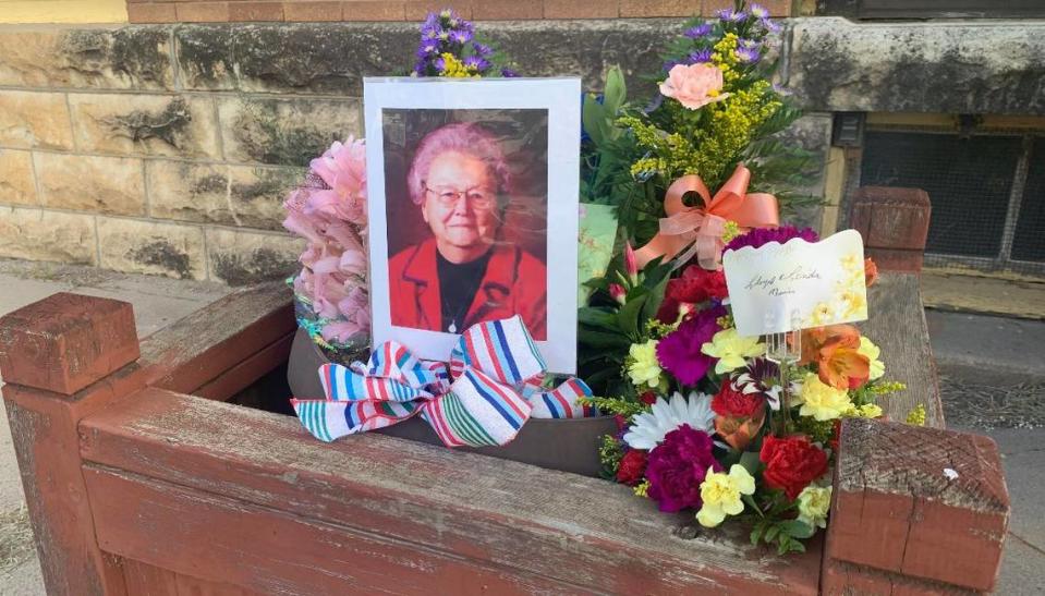 Residents left flowers outside the Marion County Record in central Kansas in remembrance of co-owner Joan Meyer, who died a day after police raided the newsroom and her home.