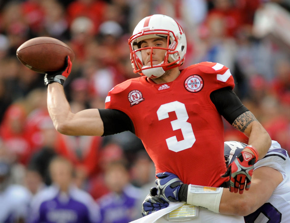 LINCOLN, NE - NOVEMBER 5: Quarterback Taylor Martinez #3 of the Nebraska Cornhuskers gets rid of the ball before being brought down during their game against the Northwestern Wildcats at Memorial Stadium November 5, 2011 in Lincoln, Nebraska. (Photo by Eric Francis/Getty Images)