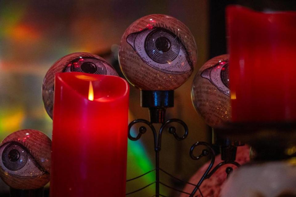 A candelabra decorated with eyeballs sits near the piano at Cafe Trio, 4558 Main St.