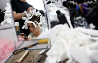 A model has her hair done backstage before Christian Dior's Haute Couture Spring-Summer 2017 live show to celebrate Dior's new flagship store at the Ginza Six mall in Tokyo, Japan, April 19, 2017. REUTERS/Toru Hanai