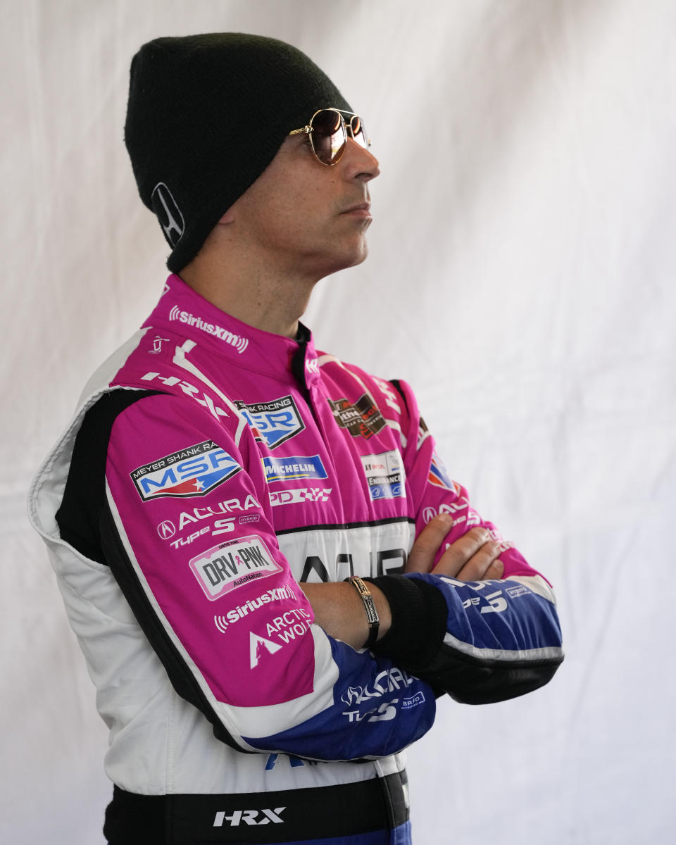 Helio Castroneves waits in his pit stall during a practice session for the Rolex 24 hour auto race at Daytona International Speedway, Thursday, Jan. 26, 2023, in Daytona Beach, Fla. (AP Photo/John Raoux)