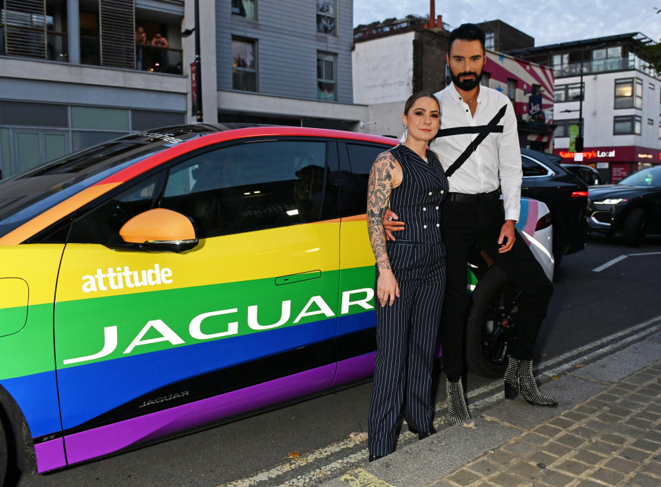 Rylan Clark-Neal (R) and Lucy Spraggan arrive in a Jaguar I-PACE to the Attitude Awards at The Roundhouse on October 06, 2021 in London, England. (Photo by David M. Benett/Dave Benett/Getty Images for Jaguar UK)