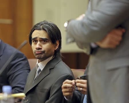 Derek Medina listens to the opening statements during his trial in Miami-Dade Circuit Court in Miami, Florida November 10, 2015. REUTERS/Walter Michot/Miami Herald/Pool