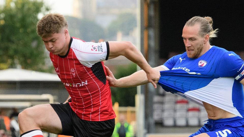 Freddie Draper of Lincoln City and Jamie Grimes of Chesterfield