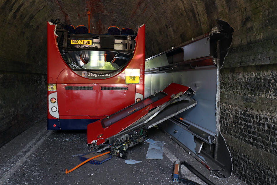 The scene on Well House Lane in Winchester after three children were taken to hospital with serious injuries while 12 others suffered minor injuries after the school bus they were travelling in crashed into a railway bridge.