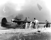 <p>Sailors attempt to save a burning PBY amphibious aircraft during the Japanese raid on Naval Air Station Kaneohe Bay, Hawaii, on Dec. 7, 1941. (U.S. Navy/U.S. Naval History and Heritage Command/Handout via Reuters) </p>
