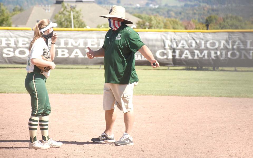 Herkimer College softball coach P.J. Anadio (right) talks with a pitcher during a fall split squad scrimmage in 2020. Anadio has been away from his team for health reasons but was cleared this weekend to rejoin the Generals for the national tournament in Syracuse.