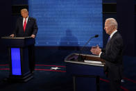 Democratic presidential candidate former Vice President Joe Biden answers a question as President Donald Trump listens during the second and final presidential debate Thursday, Oct. 22, 2020, at Belmont University in Nashville, Tenn. (AP Photo/Morry Gash, Pool)