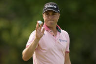 FILE - Justin Thomas waves after making a putt on the 14th hole during the final round of the PGA Championship golf tournament at Southern Hills Country Club, Sunday, May 22, 2022, in Tulsa, Okla. (AP Photo/Eric Gay, File)
