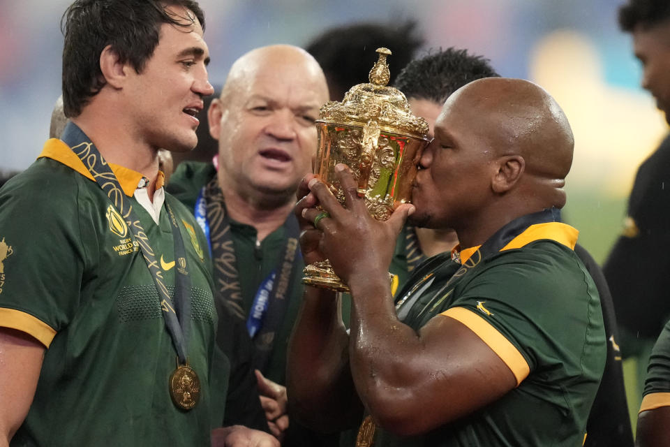 South Africa's Mbongeni Mbonambi kisses the cup after the Rugby World Cup final match between New Zealand and South Africa at the Stade de France in Saint-Denis, near Paris Saturday, Oct. 28, 2023. South Africa won 12-11. (AP Photo/Pavel Golovkin)