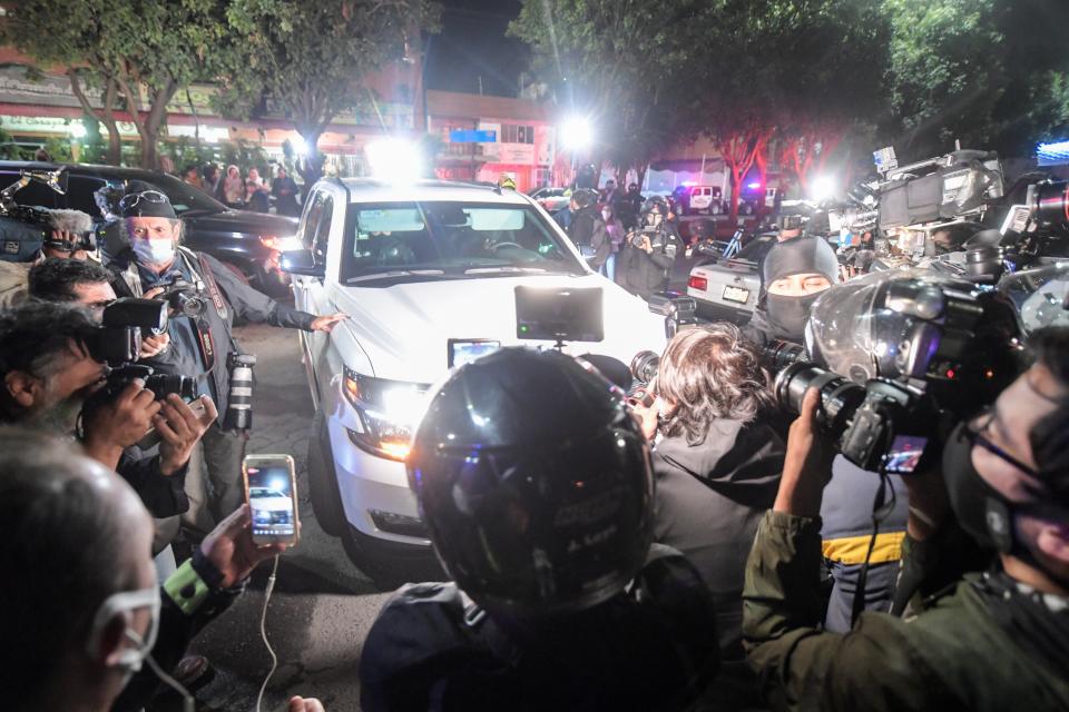 Journalists cover the arrival of Emilio Lozoya, former chief executive of Mexico's state oil company PEMEX, arriving at the General Attorney office following his extradition from Spain, in Mexico City on July 17, 2020. - Lozoya, PEMEX chief from 2012 to 2018, is accused of accepting millions of dollars in bribes from scandal-tainted Brazilian construction giant Odebrecht. (Photo by PEDRO PARDO / AFP) (Photo by PEDRO PARDO/AFP via Getty Images)