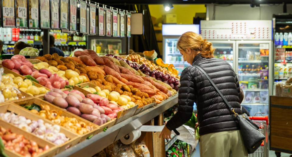 Woman grocery shopping.