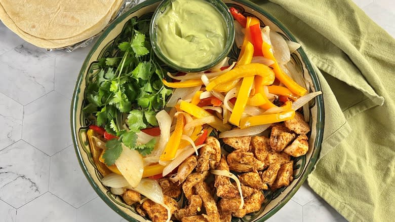 fajita fillings on plate with green napkin