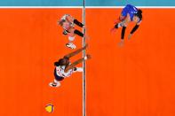 <p>China's Yuan Xinyue (R) spikes the ball in the women's preliminary round pool B volleyball match between China and USA during the Tokyo 2020 Olympic Games at Ariake Arena in Tokyo on July 27, 2021. - spikes the ball (Photo by Antonin THUILLIER / AFP)</p> 