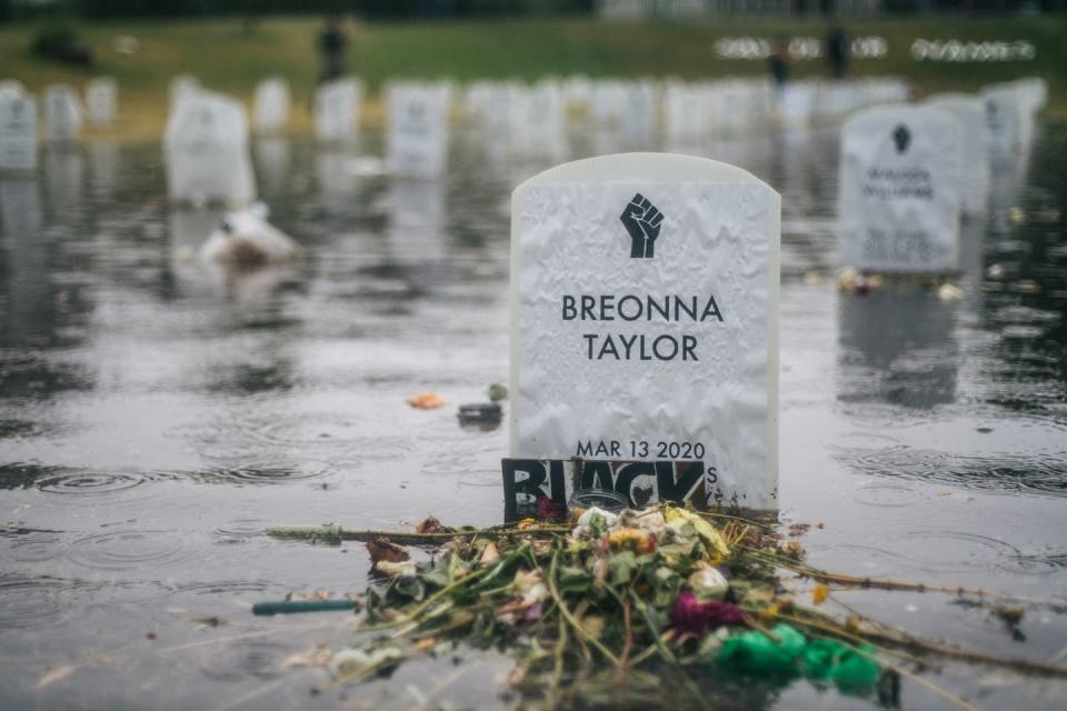 <span class="caption">A temporary tombstone commemorating Breonna Taylor, shot dead by an officer in Louisville.</span> <span class="attribution"><a class="link " href="https://www.gettyimages.com/detail/news-photo/the-say-their-names-cemetery-floods-on-june-18-2020-in-news-photo/1221069749?adppopup=true" rel="nofollow noopener" target="_blank" data-ylk="slk:Brandon Bell/Getty Images;elm:context_link;itc:0;sec:content-canvas">Brandon Bell/Getty Images</a></span>