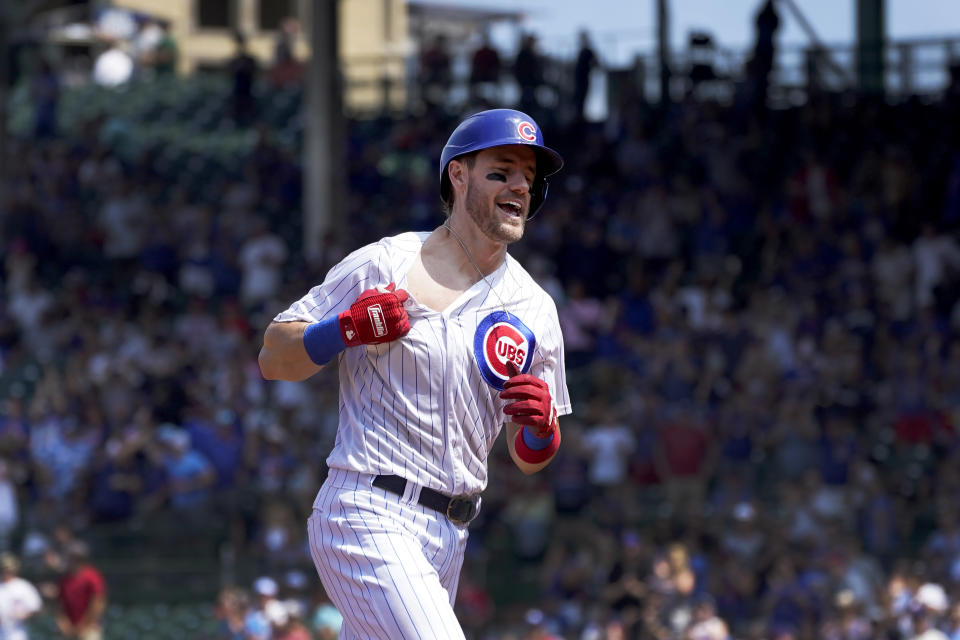 Chicago Cubs' Patrick Wisdom celebrates his home run off Cincinnati Reds starting pitcher Luis Castillo during the fourth inning of a baseball game Thursday, July 29, 2021, in Chicago. (AP Photo/Charles Rex Arbogast)