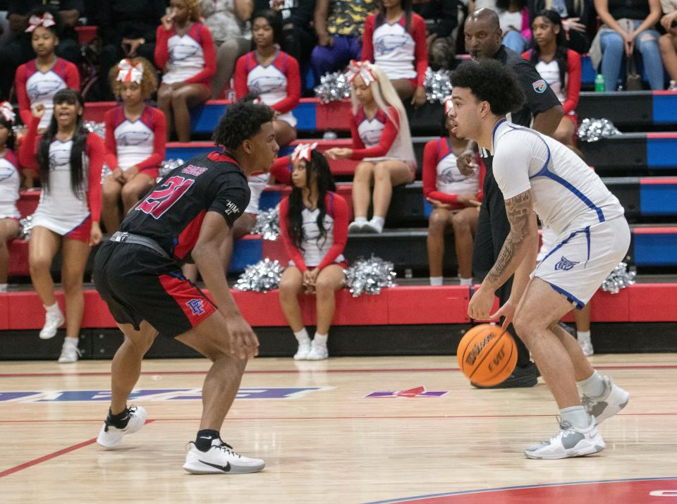 Pine Forest High School's Joshua Whitehurst (No. 21) defends against Washington High School's Nicholas Hughes (No. 5) during Wednesday night's District 1-5a quarterfinals game. 