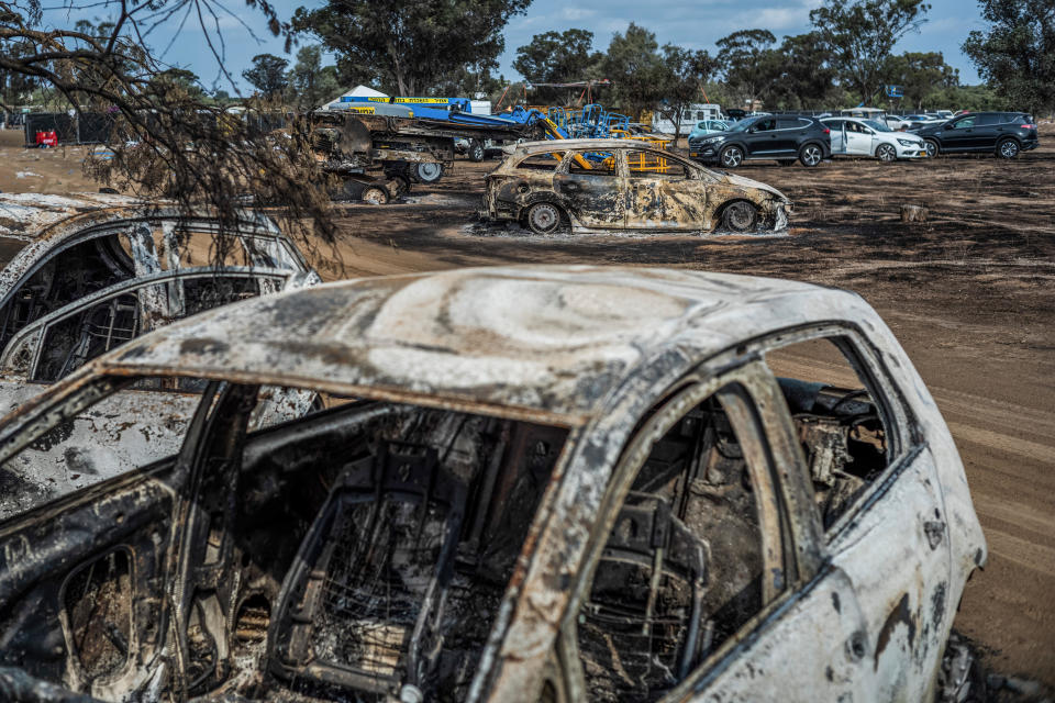 Destroyed vehicles are seen near the grounds of a music festival after a deadly attack by Hamas militants,   near Re'im, Israel, Oct. 10, 2023. / Credit: Ilia Yefimovich/picture alliance via Getty Images