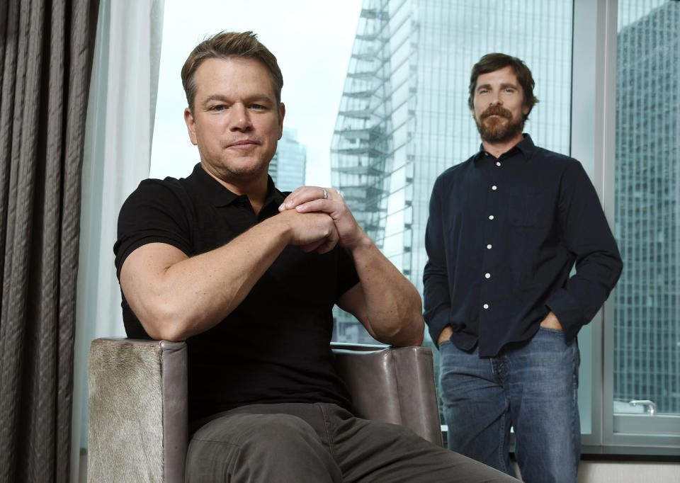 This Sept. 8, 2019 photo shows co-stars Matt Damon, left, and Christian Bale posing for a portrait to promote their film "Ford v Ferrari," at the St. Regis Hotel during the Toronto International Film Festival. The film, directed by James Mangold, hits theaters on Nov. 15. (Photo by Chris Pizzello/Invision/AP)