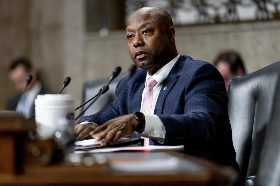 FILE - Sen. Tim Scott, R-S.C., speaks as Treasury Secretary Janet Yellen and Federal Reserve Chairman Jerome Powell testify during a Senate Banking Committee hearing on Capitol Hill in Washington, Nov. 30, 2021. Scott has filed paperwork to enter the 2024 Republican presidential race. He'll be testing whether a more optimistic vision of America’s future can resonate with GOP voters who have elevated partisan brawlers in recent years. (AP Photo/Andrew Harnik, File)