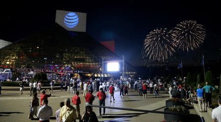 People watch a fireworks show from the Rock and Roll Hall of Fame during a Rock the Night kick off party on the sidelines of the Republican National Convention in Cleveland, Ohio, U.S., July 17, 2016. REUTERS/Aaron Josefczyk