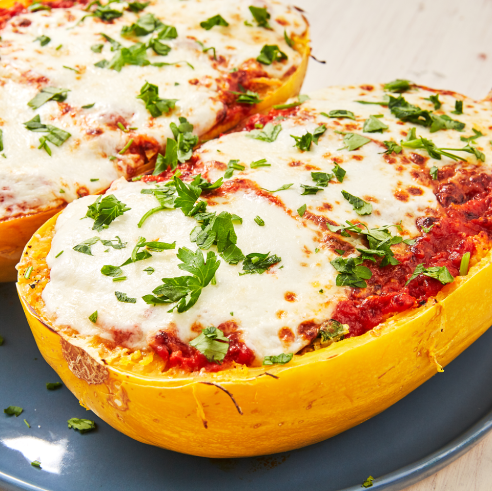 instant pot cheesy spaghetti squash on a blue plate