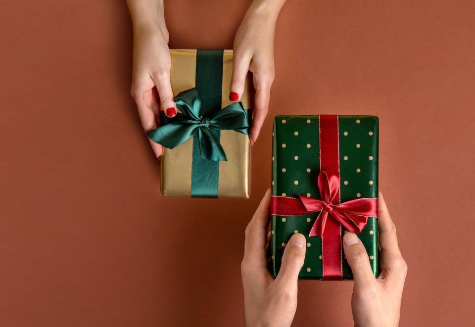 Gifts are usually given reciprocally. <a href="https://www.gettyimages.com/detail/photo/woman-giving-her-boyfriend-a-wrapped-christmas-gift-royalty-free-image/1287618519" rel="nofollow noopener" target="_blank" data-ylk="slk:Svetlana_nsk/iStock via Getty Images Plus;elm:context_link;itc:0;sec:content-canvas" class="link ">Svetlana_nsk/iStock via Getty Images Plus</a>