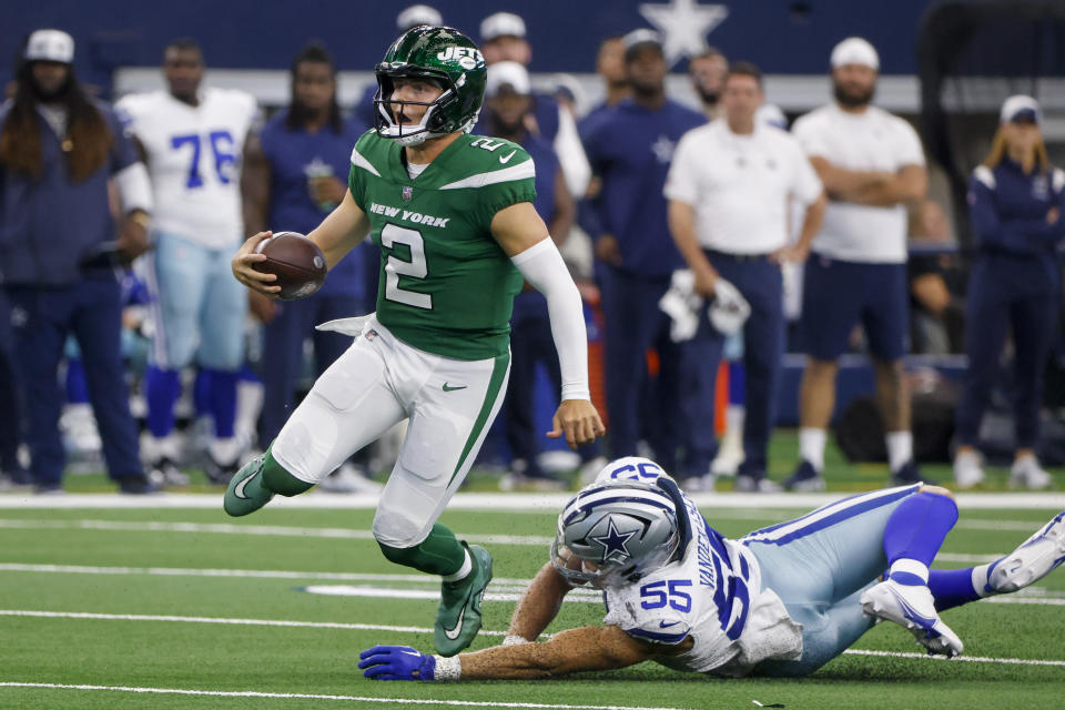 New York Jets quarterback Zach Wilson is tackled by Dallas Cowboys linebacker Leighton Vander Esch during the first half of an NFL football game in Arlington, Texas, Sunday, Aug. 17, 2023. (AP Photo/Michael Ainsworth)