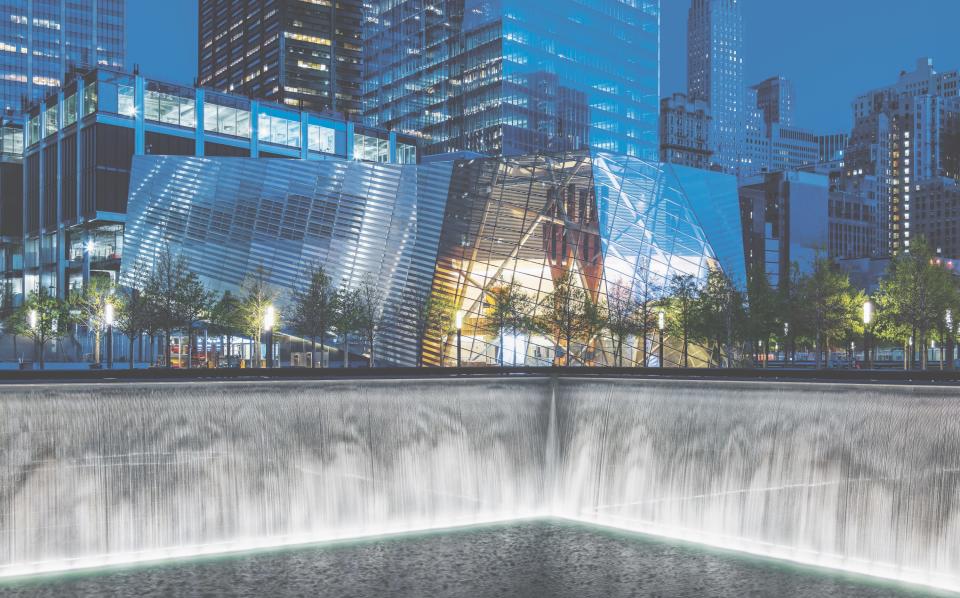 The <strong>National September 11 Memorial Museum Pavilion</strong> brings serenity to an emotion-filled site. The firm had to balance security and visitor comfort to create the pavillion, which is the only building on the memorial grounds. Warm materials and natural light are abundant in the interior, and the exterior features custom-etched stainless steel surfaces.