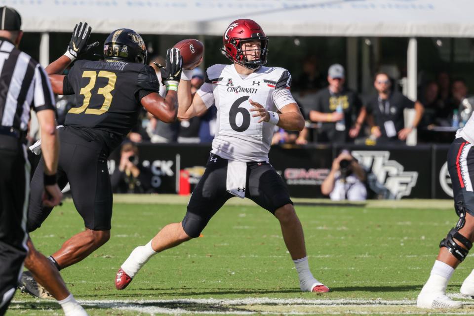 Oct 29, 2022; Orlando, Florida, USA; Cincinnati Bearcats quarterback Ben Bryant (6) drops back to pass during the first quarter against the UCF Knights at FBC Mortgage Stadium. Mandatory Credit: Mike Watters-USA TODAY Sports