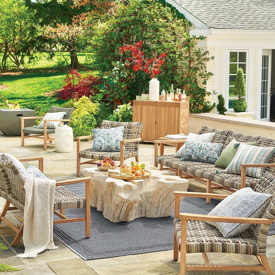 a patio with chairs and tables