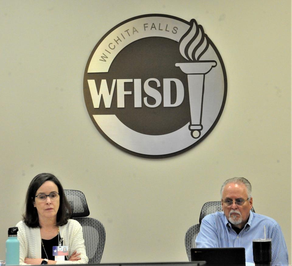 Wichita Falls ISD board members look at a tv power-point during a school board meeting at the WFISD Education Center on Friday, December 3, 2021.