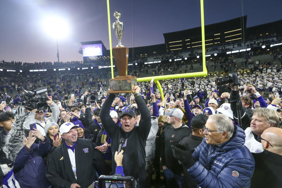 SEATTLE, WA - NOVEMBER 25: Washington head coach Kalen DeBoer holds up the Apple Cup trophy after the 115th Apple Cup college football game between the Washington Huskies and the Washington State Cougars on November 25, 2023, at Husky Stadium in Seattle, WA. (Photo by Jesse Beals/Icon Sportswire via Getty Images)