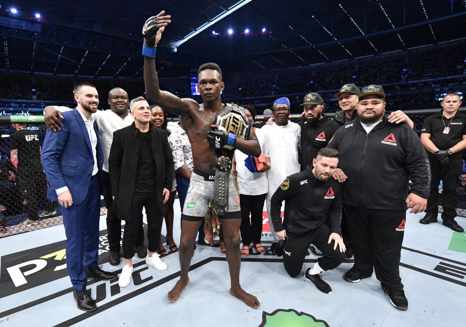 MELBOURNE, AUSTRALIA - OCTOBER 06:  Israel Adesanya of Nigeria celebrates after his knockout victory over Robert Whittaker of New Zealand in their UFC middleweight championship fight during the UFC 243 event at Marvel Stadium on October 06, 2019 in Melbourne, Australia. (Photo by Jeff Bottari/Zuffa LLC/Zuffa LLC via Getty Images)