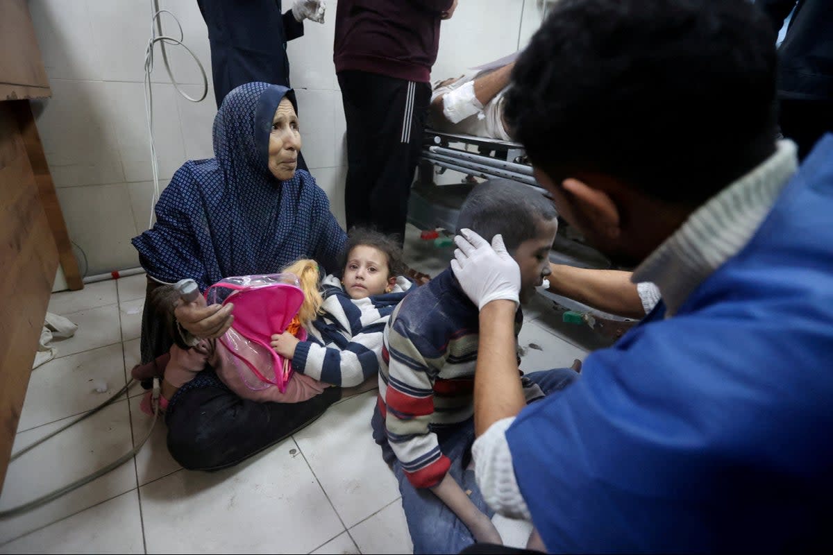 Palestinian children wounded in an Israeli strike receive treatment at Nasser hospital in Khan Younis (Reuters)