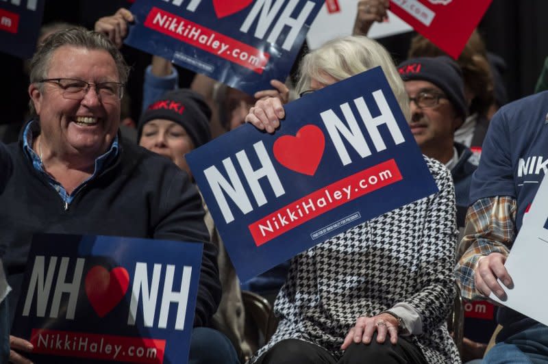 Supporters wave signs and cheer ahead of former South Carolina Gov. Nikki Haley's campaign event in Exeter, N.H., on Sunday. Photo by Amanda Sabga/UPI