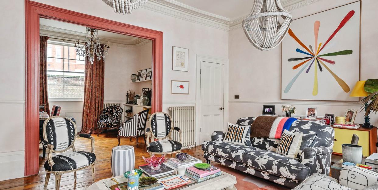 colourful living room with sofas, chairs and a coffee table