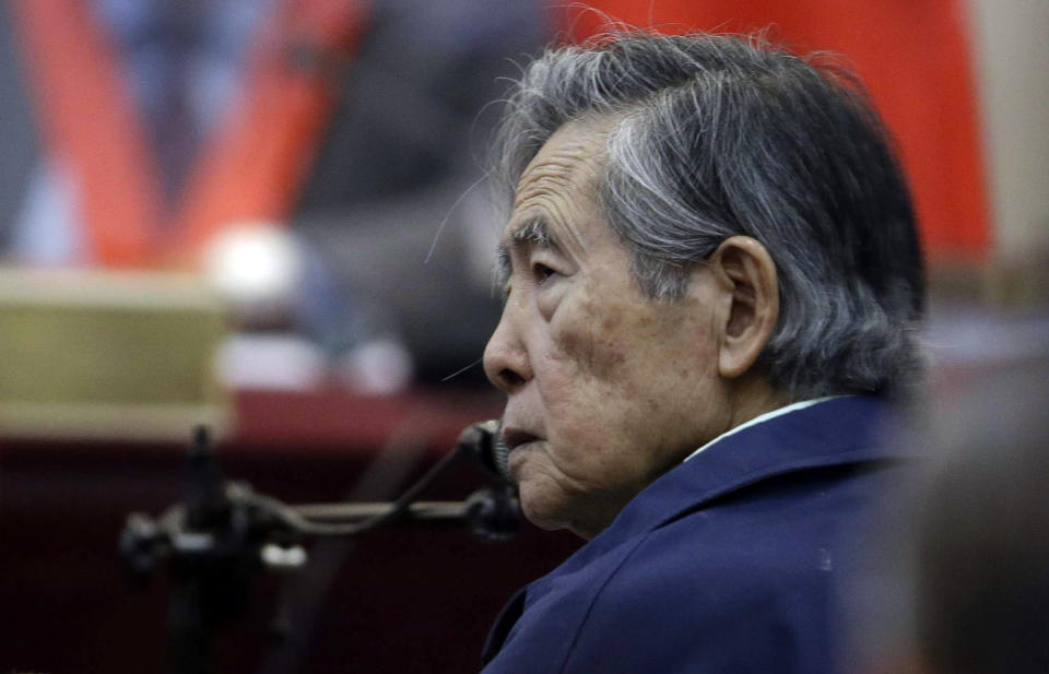FILE - In this March 15, 2018 file photo, Peru's former President Alberto Fujimori listens to a question during his testimony in a courtroom at a military base in Callao, Peru. The country's high court has overturned on Wednesday, Oct. 3, the former strongman's medical pardon and orders his return to jail. (AP Photo/Martin Mejia, File)