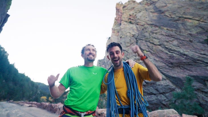 Rock climbers after setting speed record on Naked Edge rock climb.