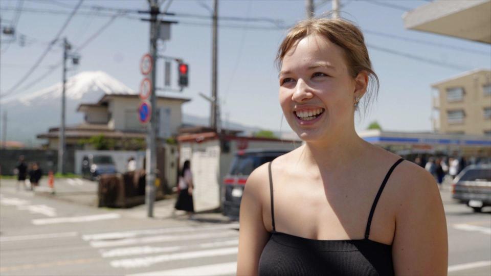 Coralie Nieke, Australian tourist, stands in front of road crossing