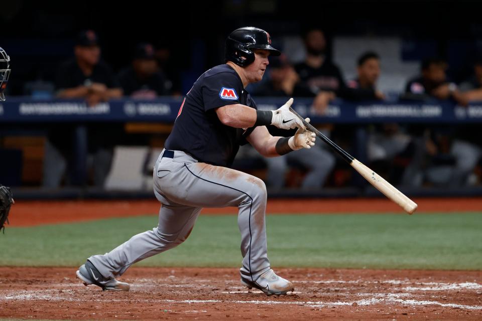Cleveland Guardians' Kole Calhoun watches his RBI single against the Tampa Bay Rays during the eighth inning of a baseball game Saturday, Aug. 12, 2023, in St. Petersburg, Fla. (AP Photo/Scott Audette)
