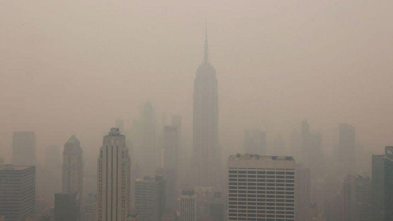 Midtown Manhattan buildings are shrouded in smoke from Canadian wildfires on June 7, 2023. 