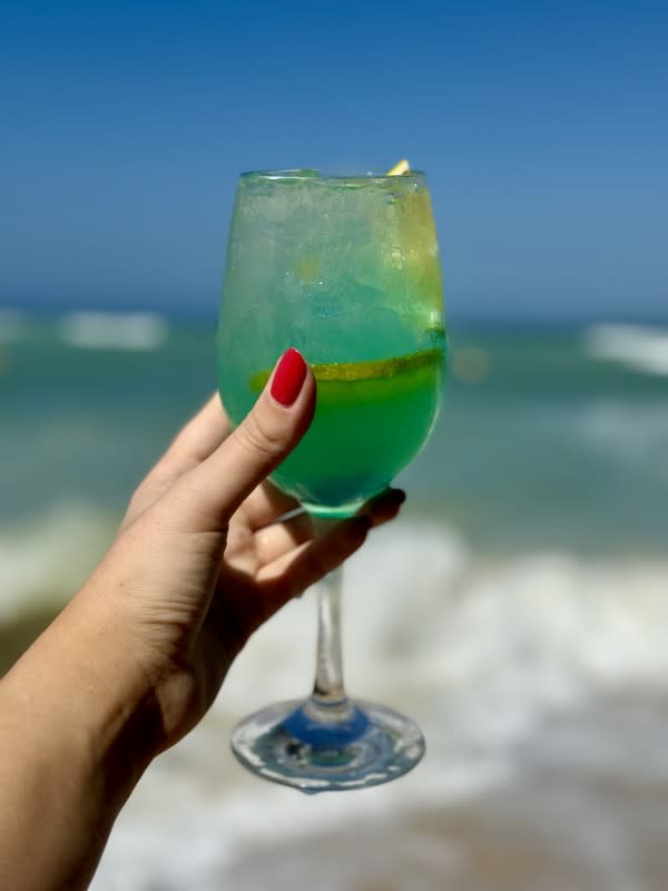<em>A cocktail that matches the ocean water? Yes, please!</em><p>Courtesy Kelsey Barberio</p>